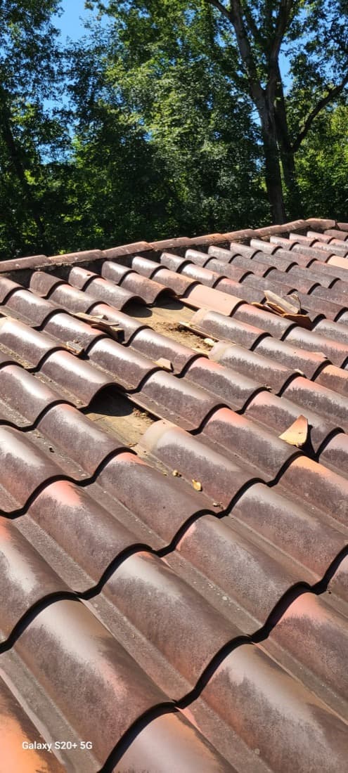 Spanish clay tile field repair showing weathered tile profile